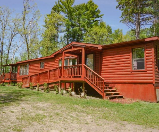Cabin 8 with entrance ramp. Woodland setting.